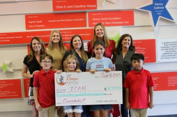 image of check presentation to charity recipient DSquared