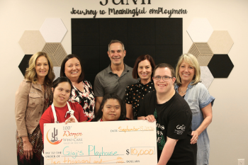 image of check presentation to charity recipient DSquared